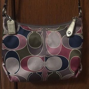 Coach purse, with an adjustable cross body strap.